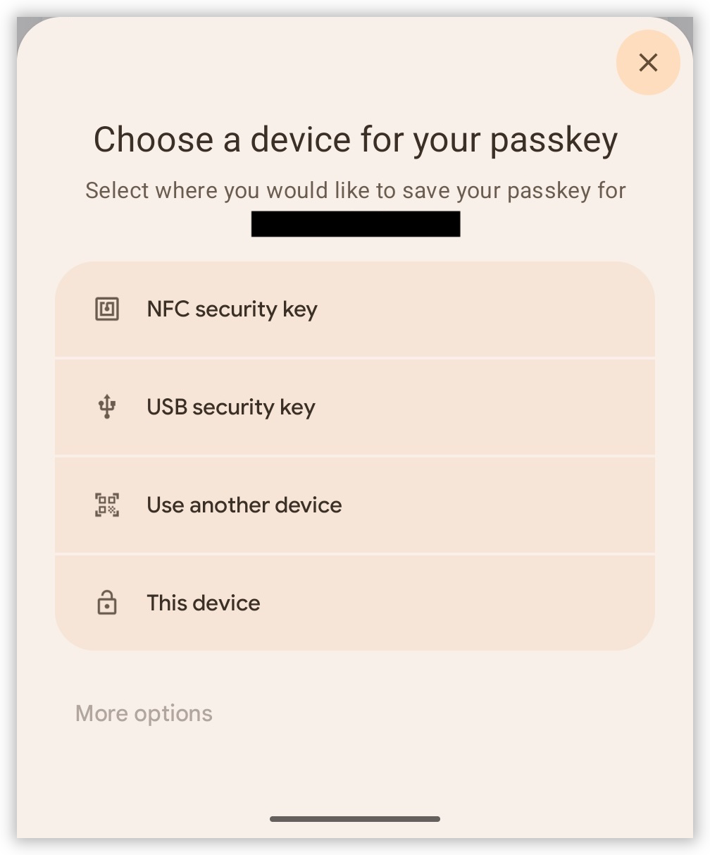 Auto-generated description: A user interface screen with options to choose a device for saving a passkey, including NFC security key, USB security key, another device, or the current device.